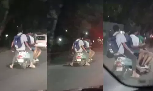ഗതാഗത നിയമങ്ങള് ലംഘിച്ച് സ്കൂട്ടറില് 5 പേര് സഞ്ചരിക്കുന്ന വീഡിയോ വൈറല്; പിന്നാലെ ഉയര്ന്നത് വ്യാപക വിമര്ശനങ്ങള് ഗതാഗത നിയമങ്ങള് ലംഘിച്ച് സ്കൂട്ടറില് 5 പേര് സഞ്ചരിക്കുന്ന വീഡിയോ വൈറല്; പിന്നാലെ ഉയര്ന്നത് വ്യാപക വിമര്ശനങ്ങള്